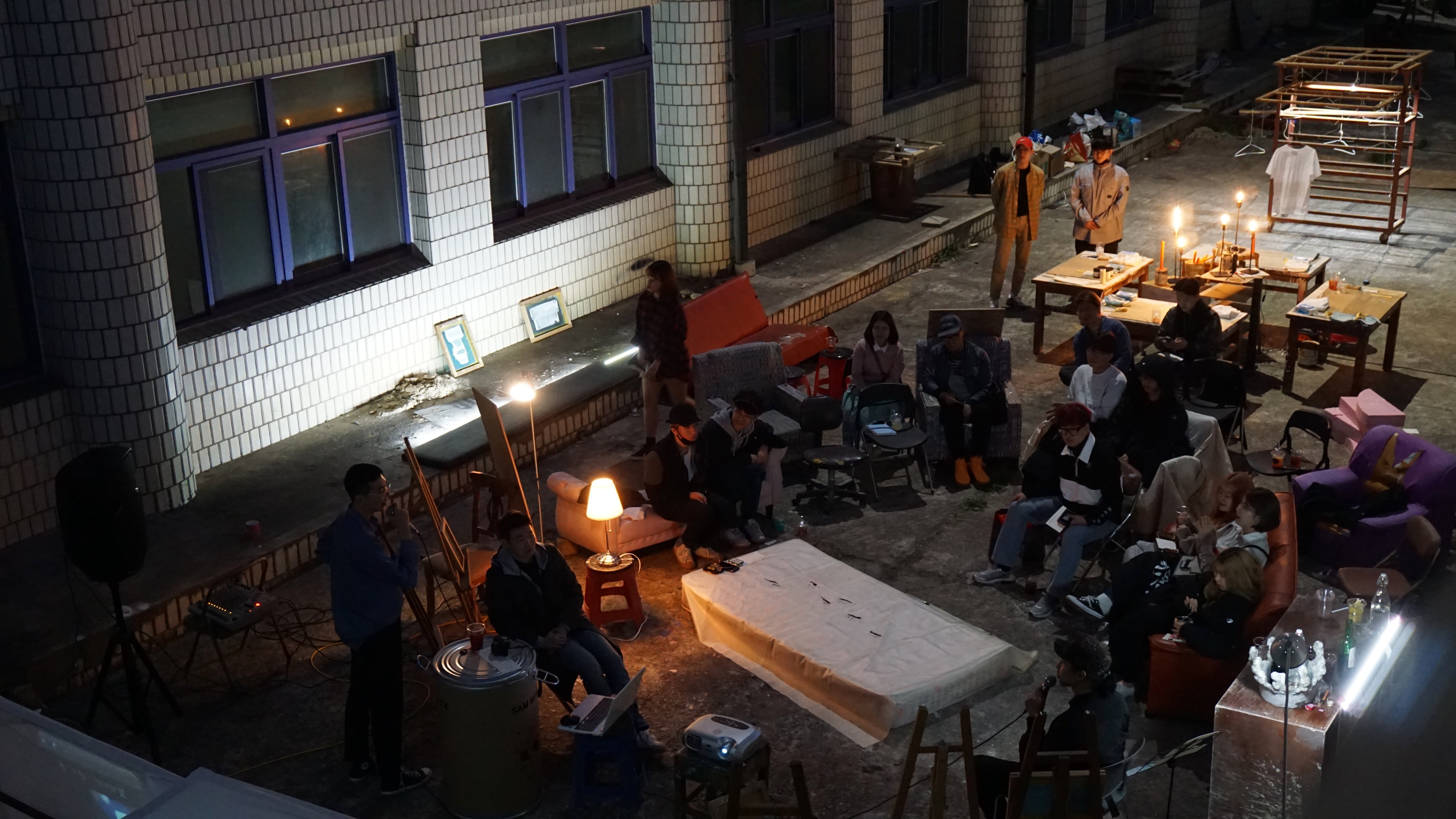 People gathered together in an evening courtyard event