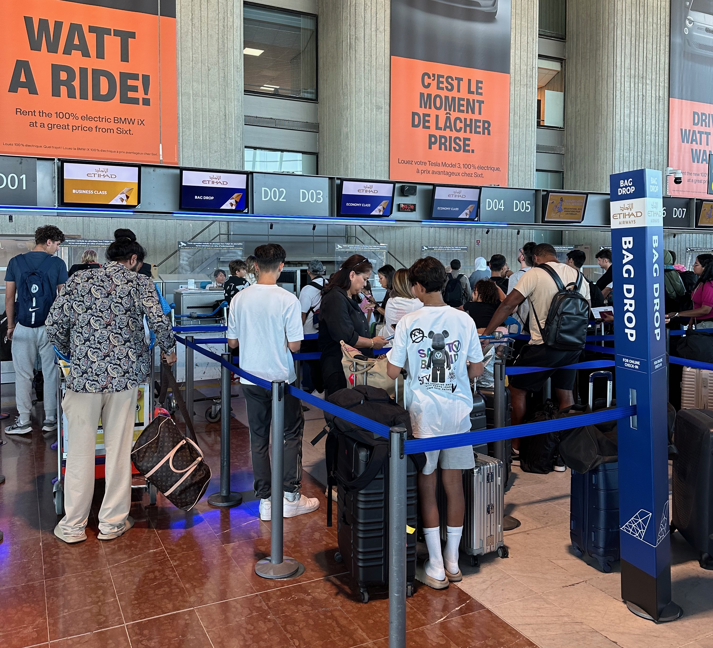 Airport bag drop counter scene photographed at the end of a journey before a new departure